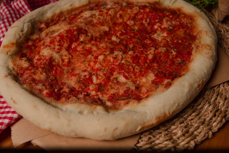 Deep-dish pizza coming out of the oven at Pequod's